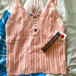 Pink tank top with single straps and cross cross front